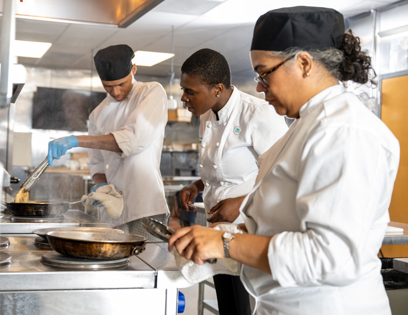 OIC Philadelphia's Culinary Arts Chef Instructor Jean provides hands-on training in North Philly in OIC's Commercial Kitchen