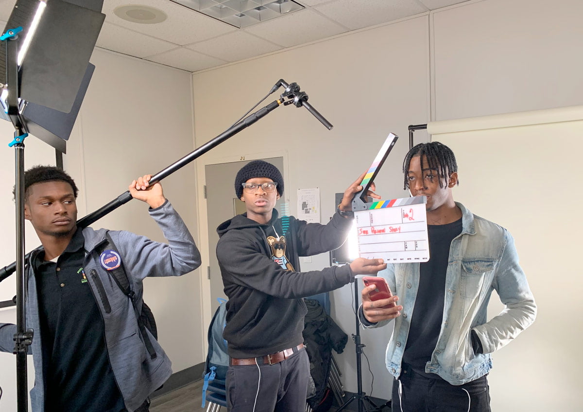In partnership with Big Picture Alliance, the digital media program teaches students how to create a documentary with camera training, editing skills and more. Students shown in the media lab with their video production gear.