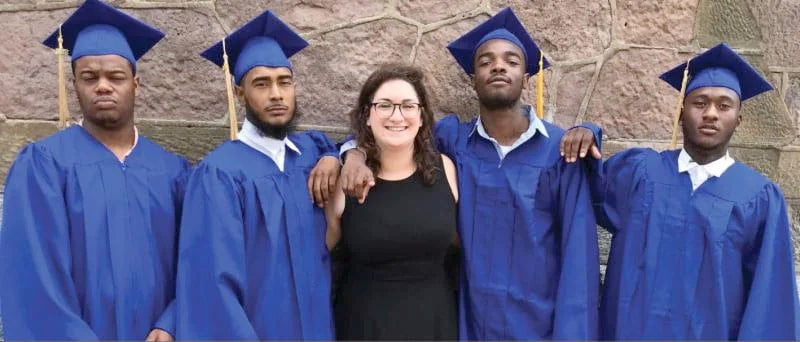 Amir Williams and classmates graduate after receiving reentry support services in 2019