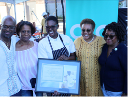 Chef Franceska Jean with family, friends, and colleague Sheila Ireland posing for a photo at the annual OIC block party